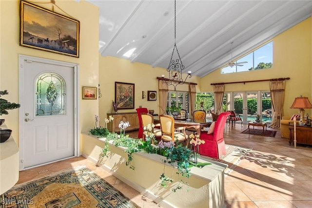 tiled entryway featuring french doors, a ceiling fan, high vaulted ceiling, and beamed ceiling