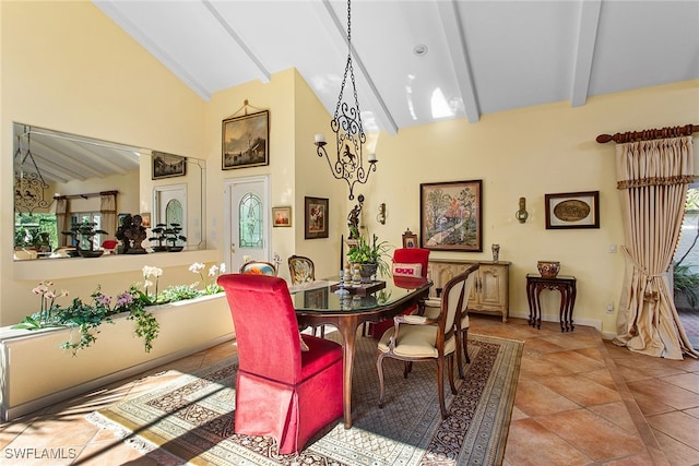 tiled dining space featuring beamed ceiling and high vaulted ceiling