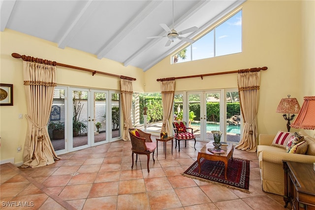 interior space with vaulted ceiling with beams, ceiling fan, and french doors