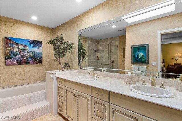 bathroom with vanity, shower with separate bathtub, and tile patterned floors