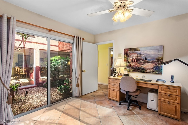 office with light tile patterned floors and ceiling fan