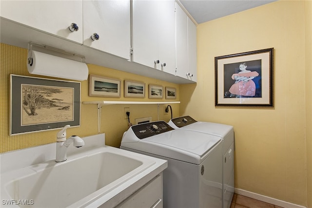 laundry room with separate washer and dryer, sink, tile patterned floors, and cabinets