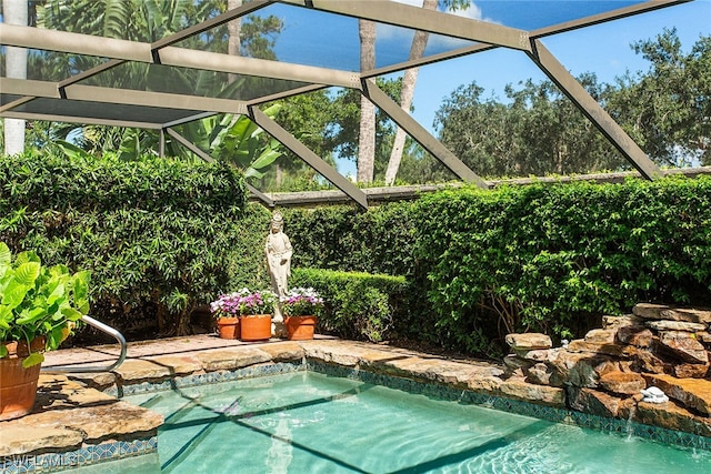 view of pool featuring a lanai