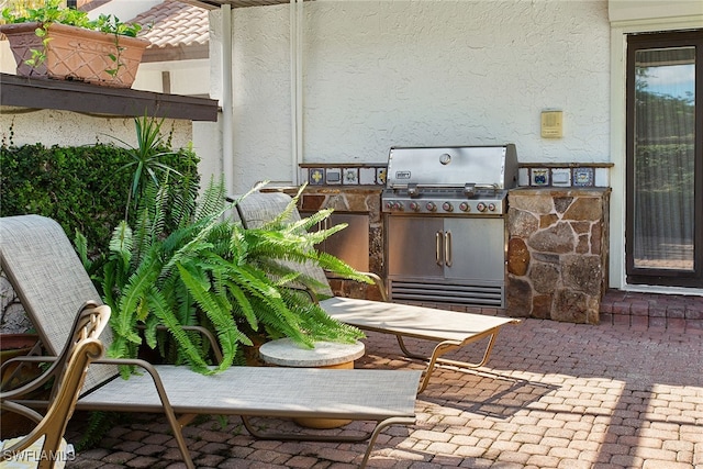 exterior space featuring area for grilling and a patio area