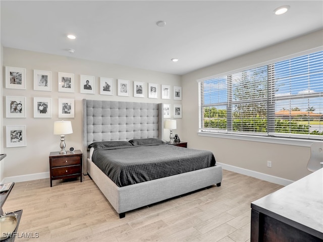 bedroom with light hardwood / wood-style floors