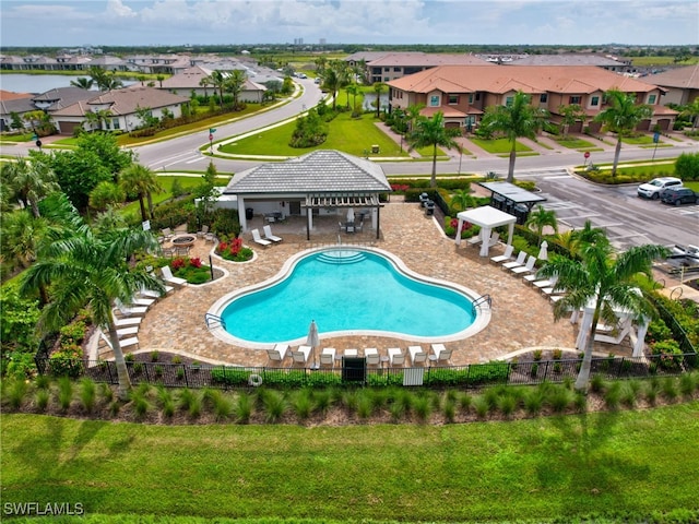 view of pool featuring a yard, a patio area, and a gazebo