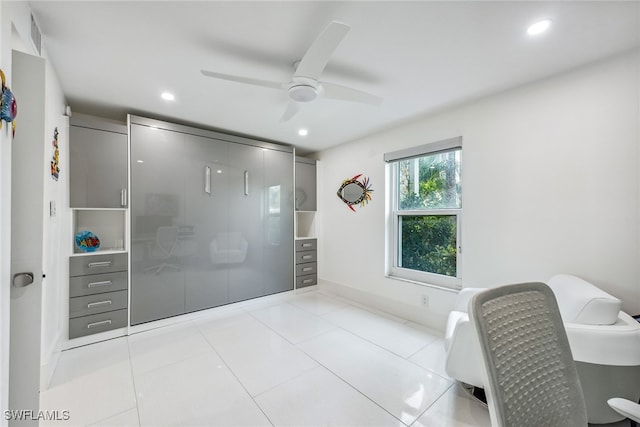 interior space featuring ceiling fan and light tile patterned floors