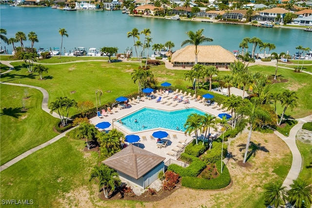 birds eye view of property with a water view