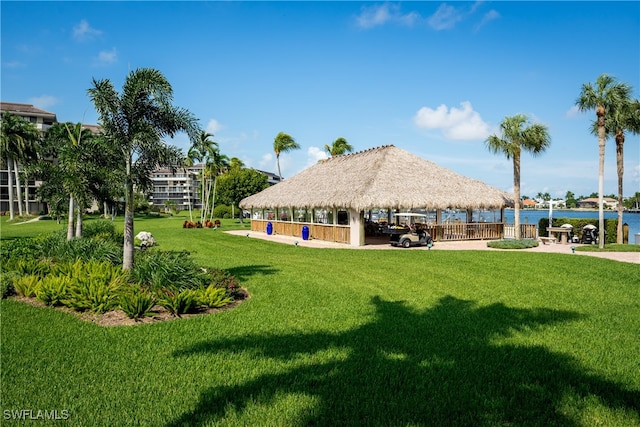 view of property's community featuring a gazebo, a yard, and a water view