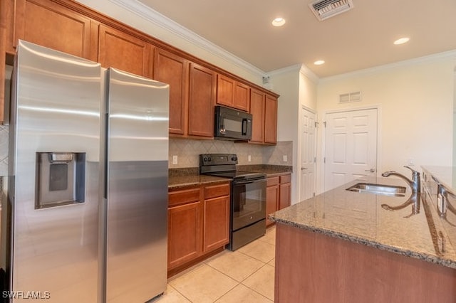 kitchen featuring light tile patterned floors, ornamental molding, stone countertops, sink, and black appliances