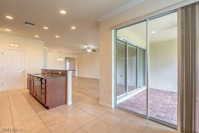 kitchen featuring dishwasher, ceiling fan, light tile patterned flooring, and decorative light fixtures