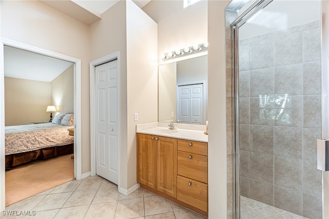 bathroom with tile patterned flooring, vanity, and a shower with shower door