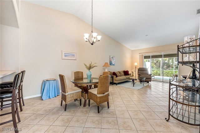 tiled dining space featuring a notable chandelier and vaulted ceiling