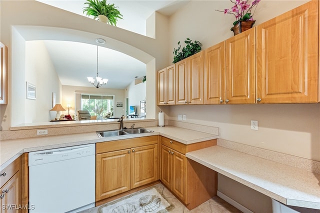 kitchen with pendant lighting, white dishwasher, light tile patterned flooring, sink, and a notable chandelier