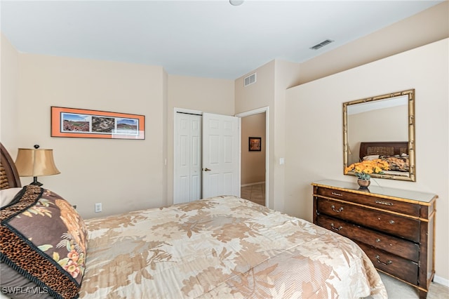 carpeted bedroom with a closet