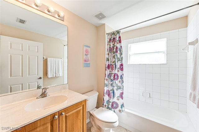 full bathroom with shower / tub combo, vanity, and toilet