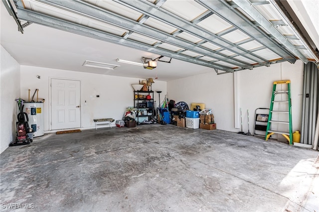 garage featuring water heater and a garage door opener