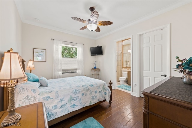 bedroom featuring ceiling fan, connected bathroom, dark wood-type flooring, and crown molding