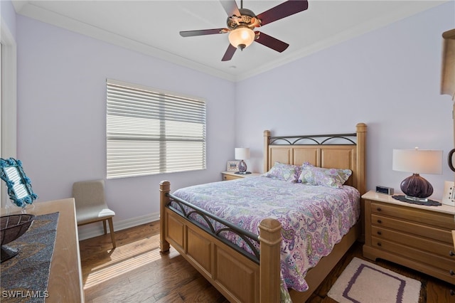 bedroom featuring ceiling fan, crown molding, and dark hardwood / wood-style flooring