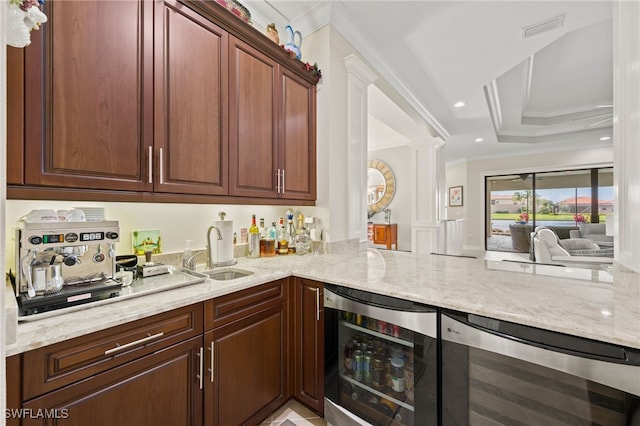 kitchen featuring crown molding, kitchen peninsula, and wine cooler