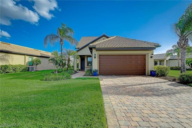 single story home with a front yard and a garage