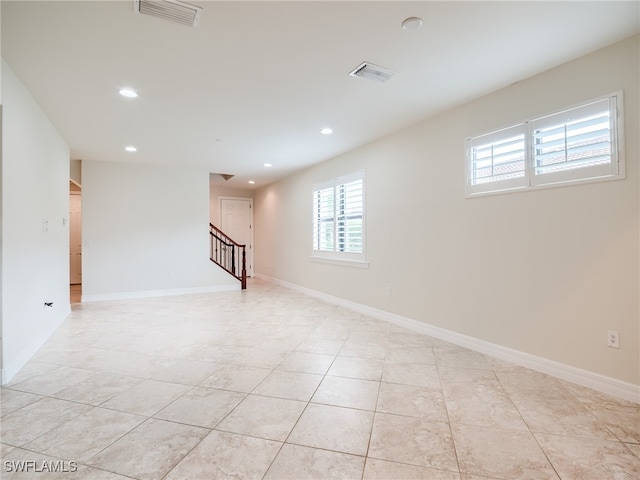 basement with light tile patterned floors