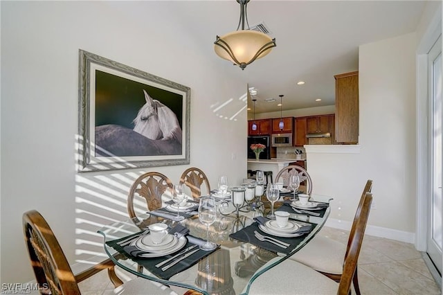 dining room featuring light tile patterned flooring