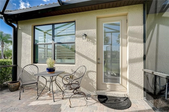 doorway to property with a patio