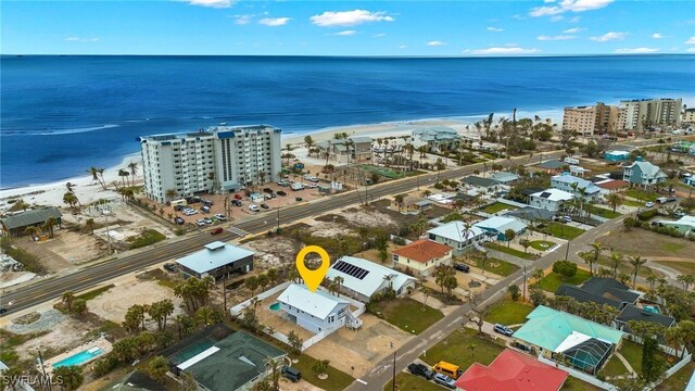 aerial view featuring a water view and a view of the beach