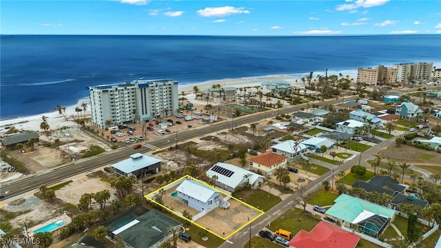 bird's eye view featuring a water view and a view of the beach