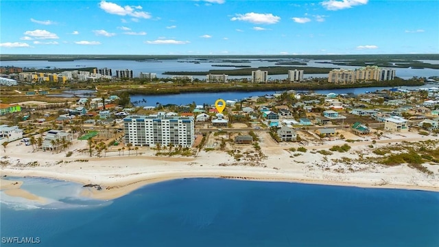 birds eye view of property featuring a water view and a view of city