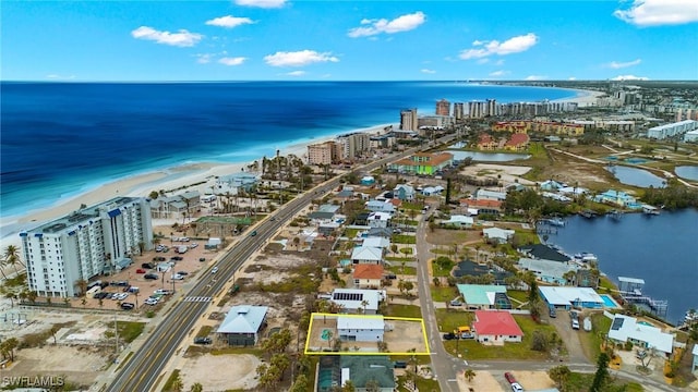 drone / aerial view featuring a water view and a city view