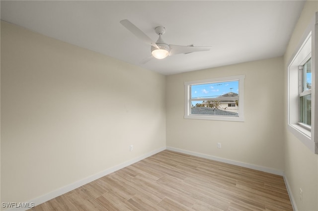 spare room with ceiling fan and light hardwood / wood-style flooring