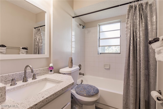 full bathroom with shower / bath combo, a textured ceiling, vanity, and toilet