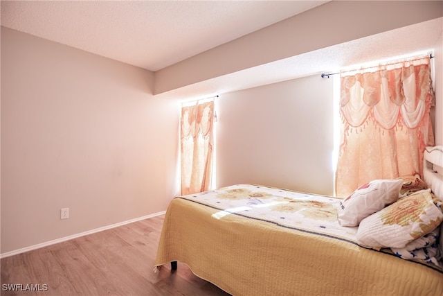 bedroom featuring wood-type flooring