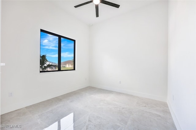 empty room with baseboards and a ceiling fan