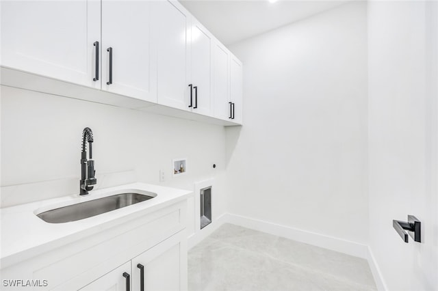 laundry area featuring washer hookup, cabinet space, hookup for an electric dryer, a sink, and baseboards