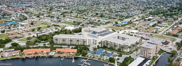 drone / aerial view featuring a water view and a city view