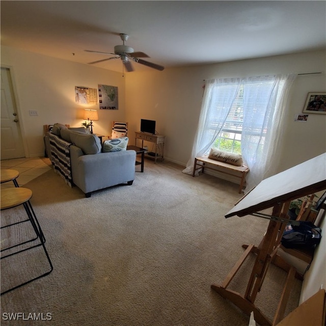 carpeted living room with ceiling fan