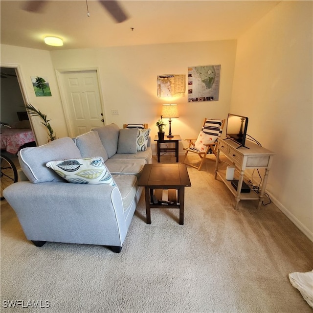 living room featuring carpet flooring and ceiling fan