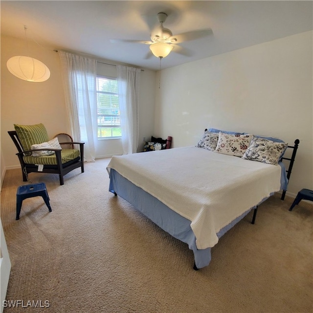 bedroom featuring ceiling fan and carpet floors