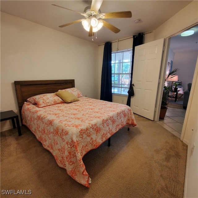 bedroom with ceiling fan and carpet flooring