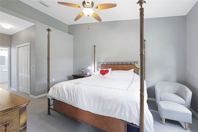 bedroom featuring ceiling fan, a closet, and carpet flooring