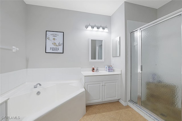 bathroom featuring plus walk in shower, tile patterned floors, and vanity