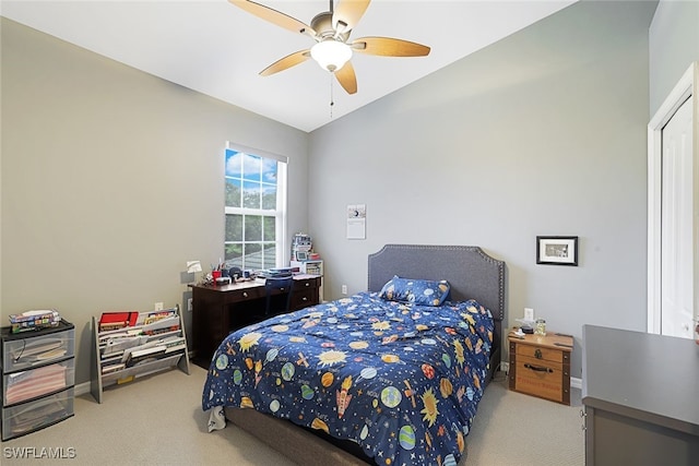 bedroom featuring lofted ceiling, ceiling fan, and light colored carpet