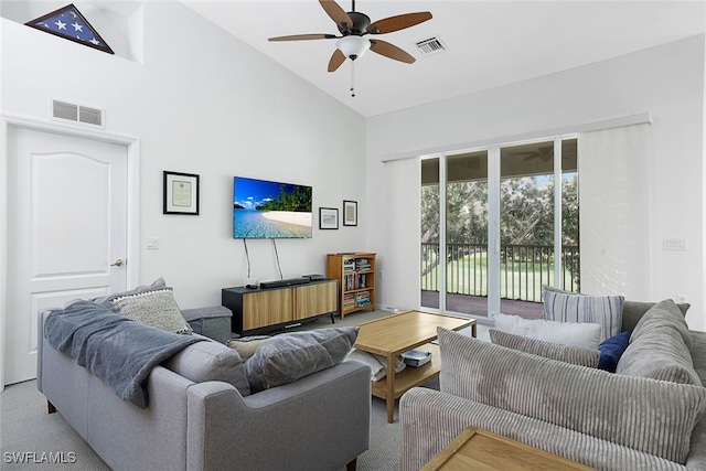 living room featuring ceiling fan, light carpet, and high vaulted ceiling