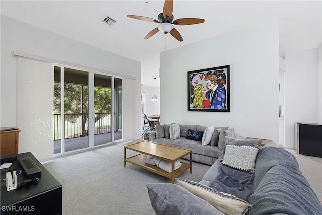 living room with light colored carpet and ceiling fan