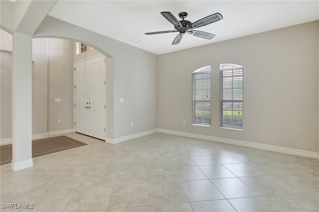 entryway featuring ceiling fan and light tile patterned flooring