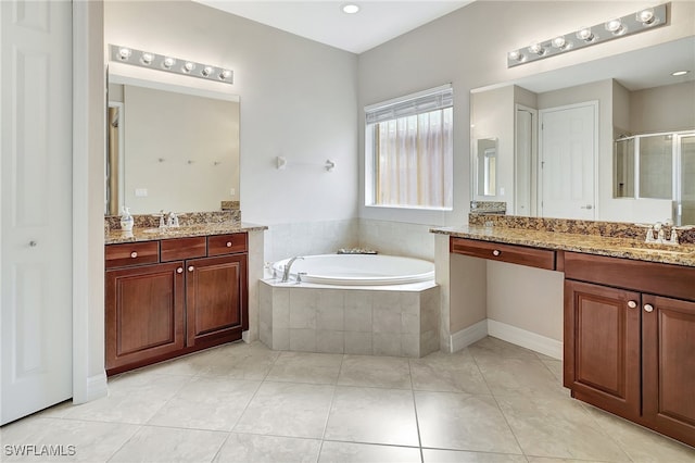 bathroom featuring tile patterned flooring, vanity, and separate shower and tub