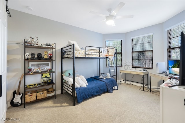 bedroom featuring ceiling fan and light colored carpet